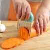 0bf8a0e5a65ea54285194379c2e1241f.jpg Stainless Steel Deep Wolf Tooth Potato Cutter with Wavy Slice Design | Kitchen Tool
