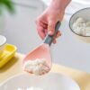 7924a270f21028ae3e442f407a094a5a.jpg 1pc Non-Stick Rice Scoop with Ergonomic Handle | Kitchen Essential