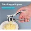 bf88eb83fdd9fd42fc899f573cd1a45e_1766124198100.jpg Stainless Steel Garlic Press Crusher | Kitchen Essential